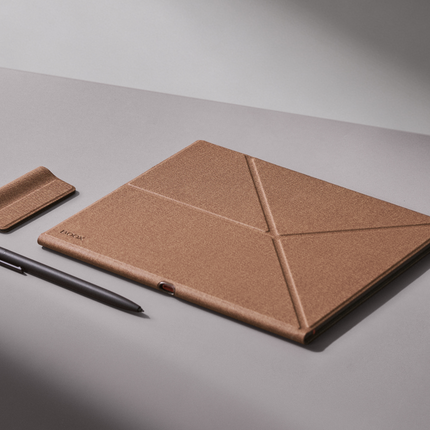 Umber Onyx Boox smart cover for the Note Air6 C with a stylus and holder loop on a grey surface