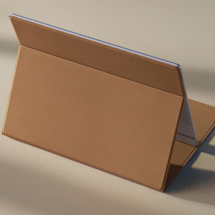 Tan Onyx Boox smart cover folded into a stand position on a beige surface