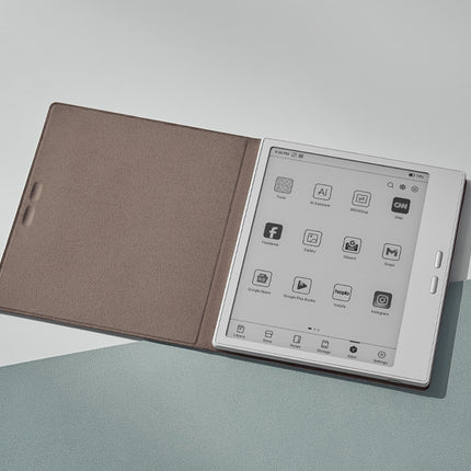 Onyx Boox Go 7 e-reader with a taupe smart cover folded open, showing the app home screen