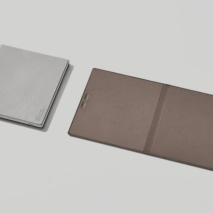 Grey and taupe Onyx Boox smart covers lying flat side by side