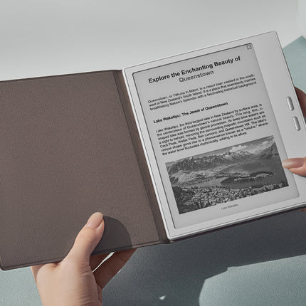 Hands holding an Onyx Boox Go 7 with a taupe smart cover open, showing a page of text